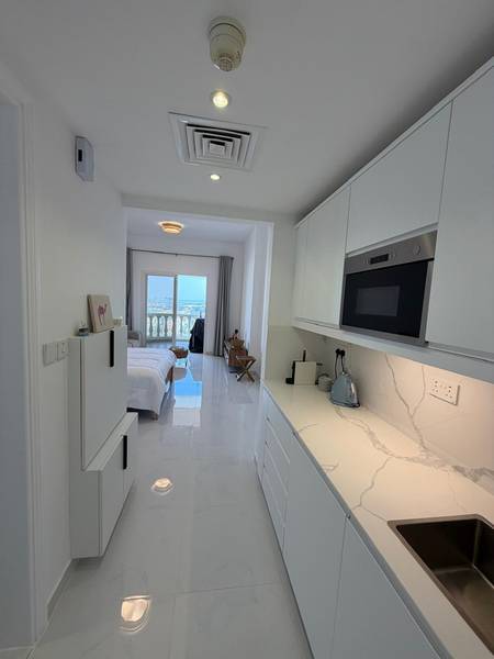 The same RAK studio after renovation — fresh walls, modern finish