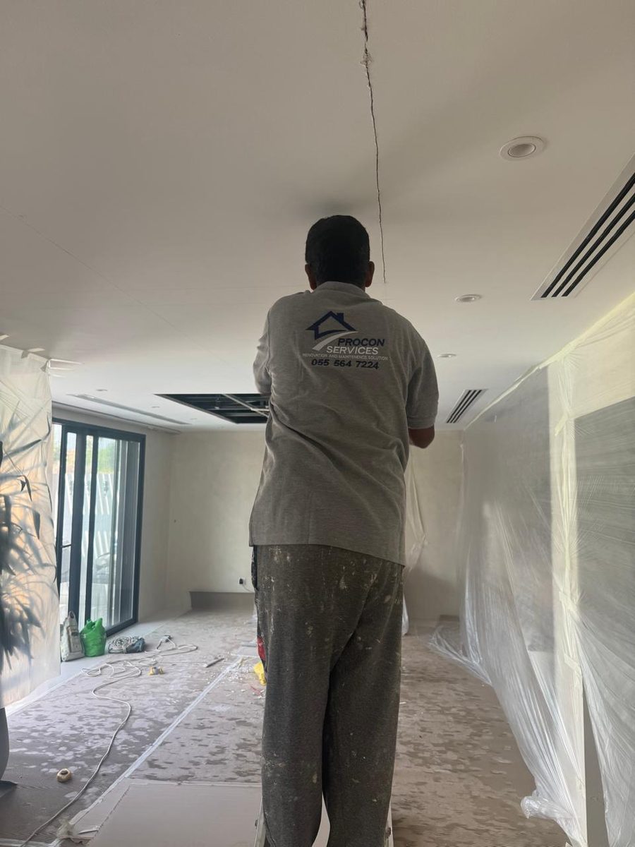 Procon team working on the ceiling of a modern villa