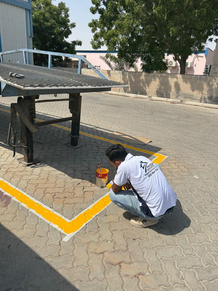Procon team painting parking lines on an exterior surface